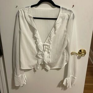 Sheer long sleeve tie front blouse